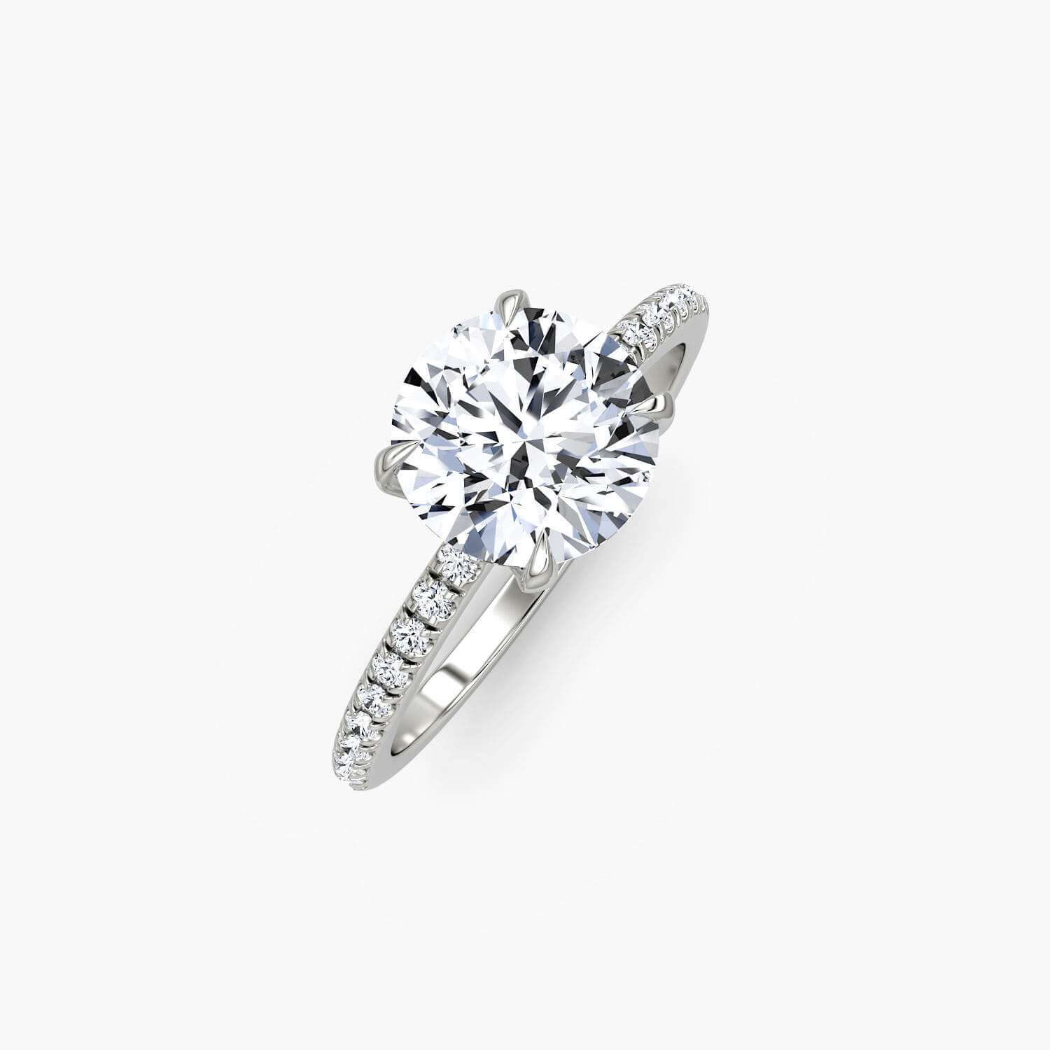 Classic solitaire engagement ring with a round brilliant diamond set in 14k white gold, showcasing elegant jewelry craftsmanship.