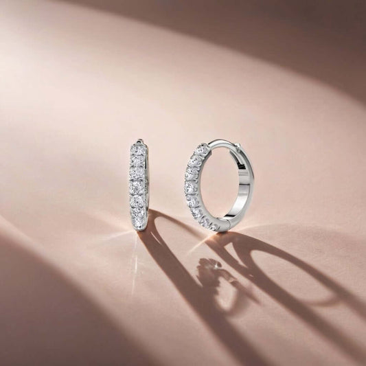 Diamond U-Shape Huggie Earrings in 14k gold, featuring a seamless row of hand-set diamonds. Elegant jewelry with a modern twist.