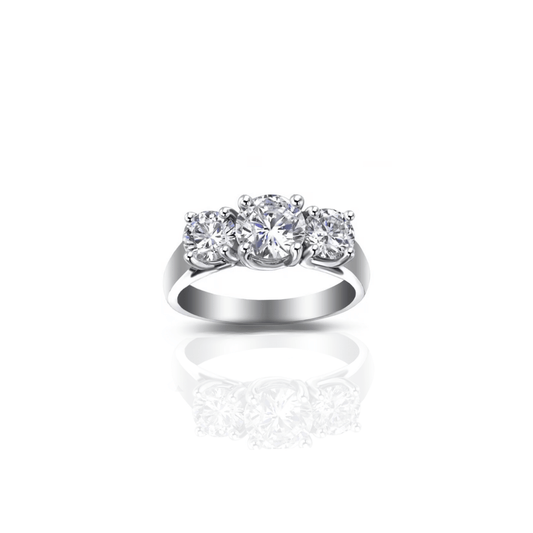 Three-stone gold engagement ring with dazzling diamonds, symbolizing timeless romance by Maison Karat.