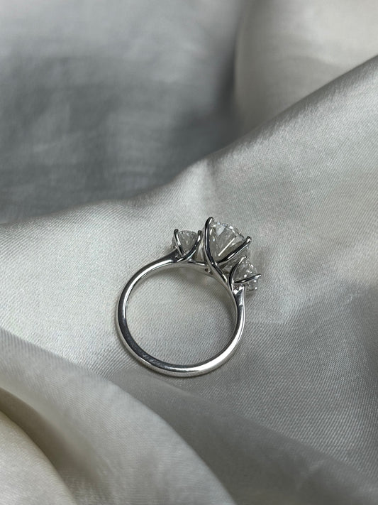Three-stone oval lab gown engagement ring