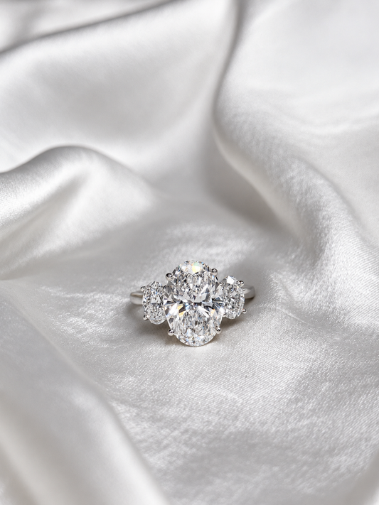 Three-stone oval lab gown engagement ring